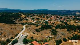 Panoramic view of a picturesque village with the greek countryside as a background